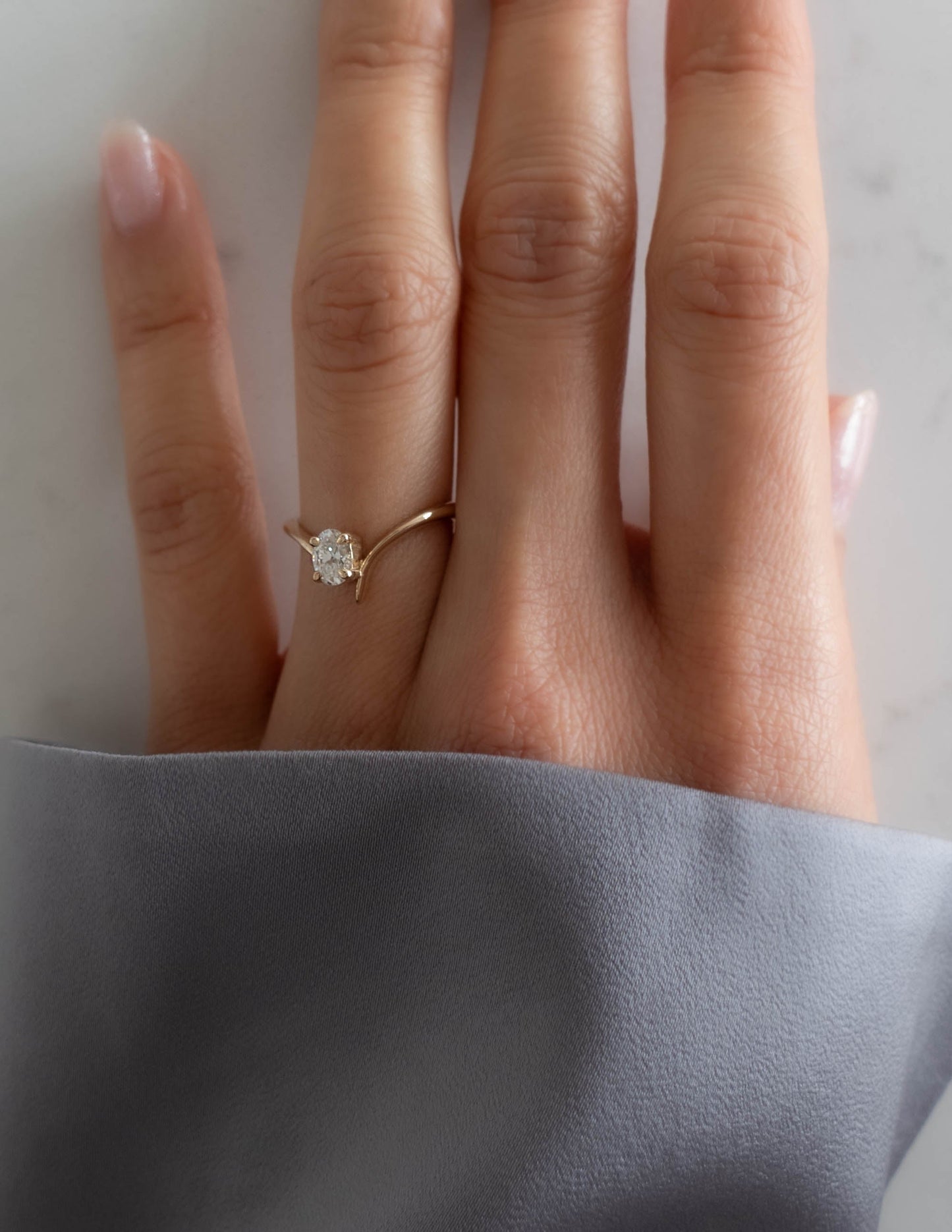 Cadette Oval Eve engagement ring with claw setting. Oval nature inspired engagement ring. Oval plant inspired engagement ring.