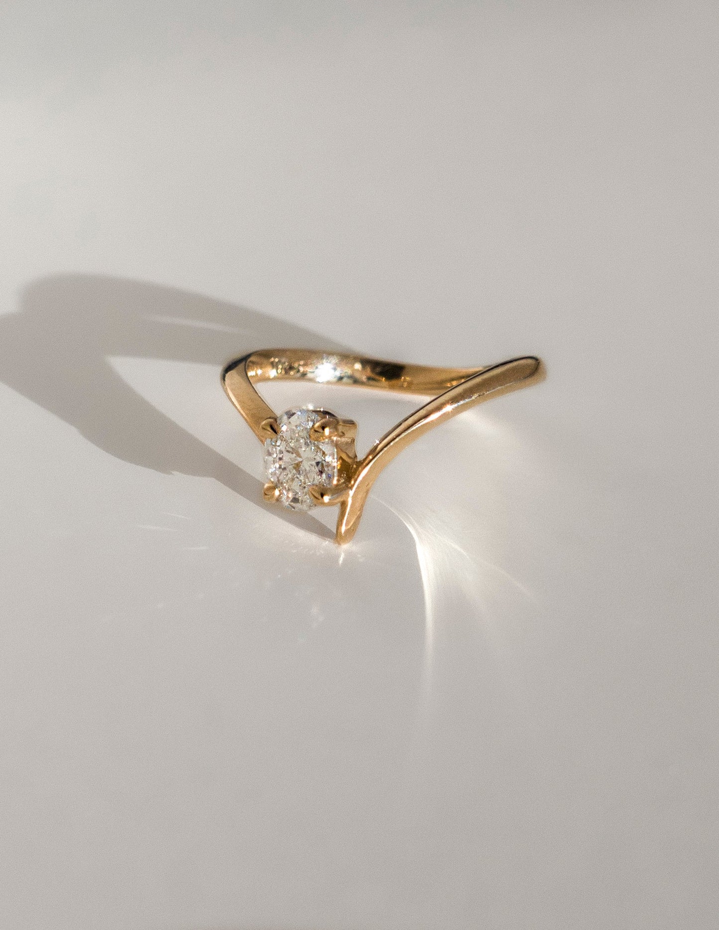 Cadette Oval Eve engagement ring with claw setting. Oval nature inspired engagement ring. Oval plant inspired engagement ring.