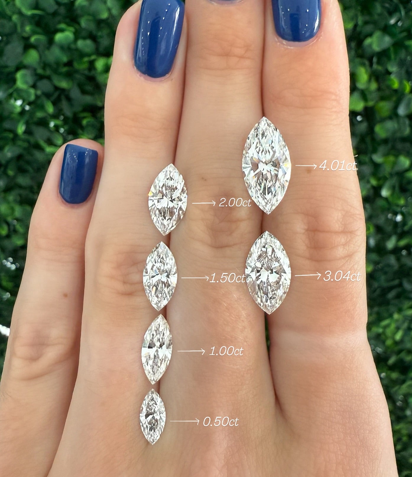 marquis diamonds showing in hands to compare different carat sizes of solitaires
