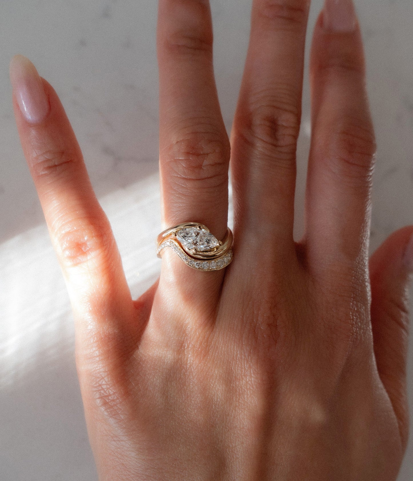 Cadette Marquise Rapture engagement ring set with band. Marquise Ocean Inspired Engagement solitaire Ring with band. Marquise Nature Inspired Engagement solitaire Ring with band.
