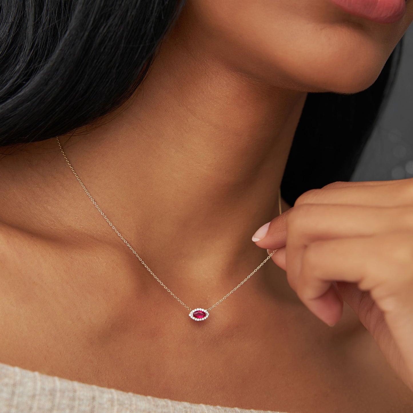 14k Marquise Ruby with Halo Diamond Setting